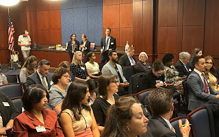 This image is of some of the speakers and the audience at the Capital Briefing