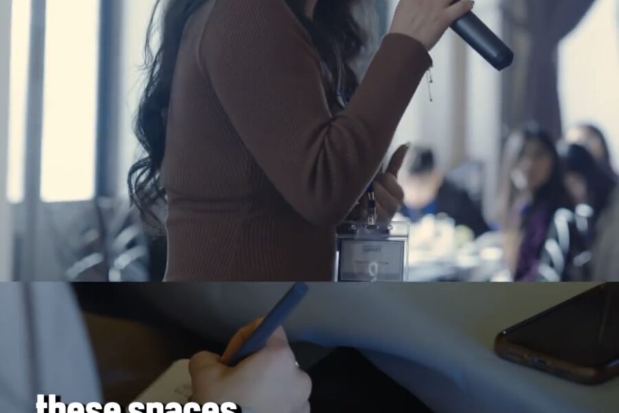 The image shows a split screen of woman speaking into a microphone and underneath is someone writing into a journal