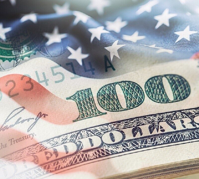 This image is of an 100 dollar U.S bill with the American Flag